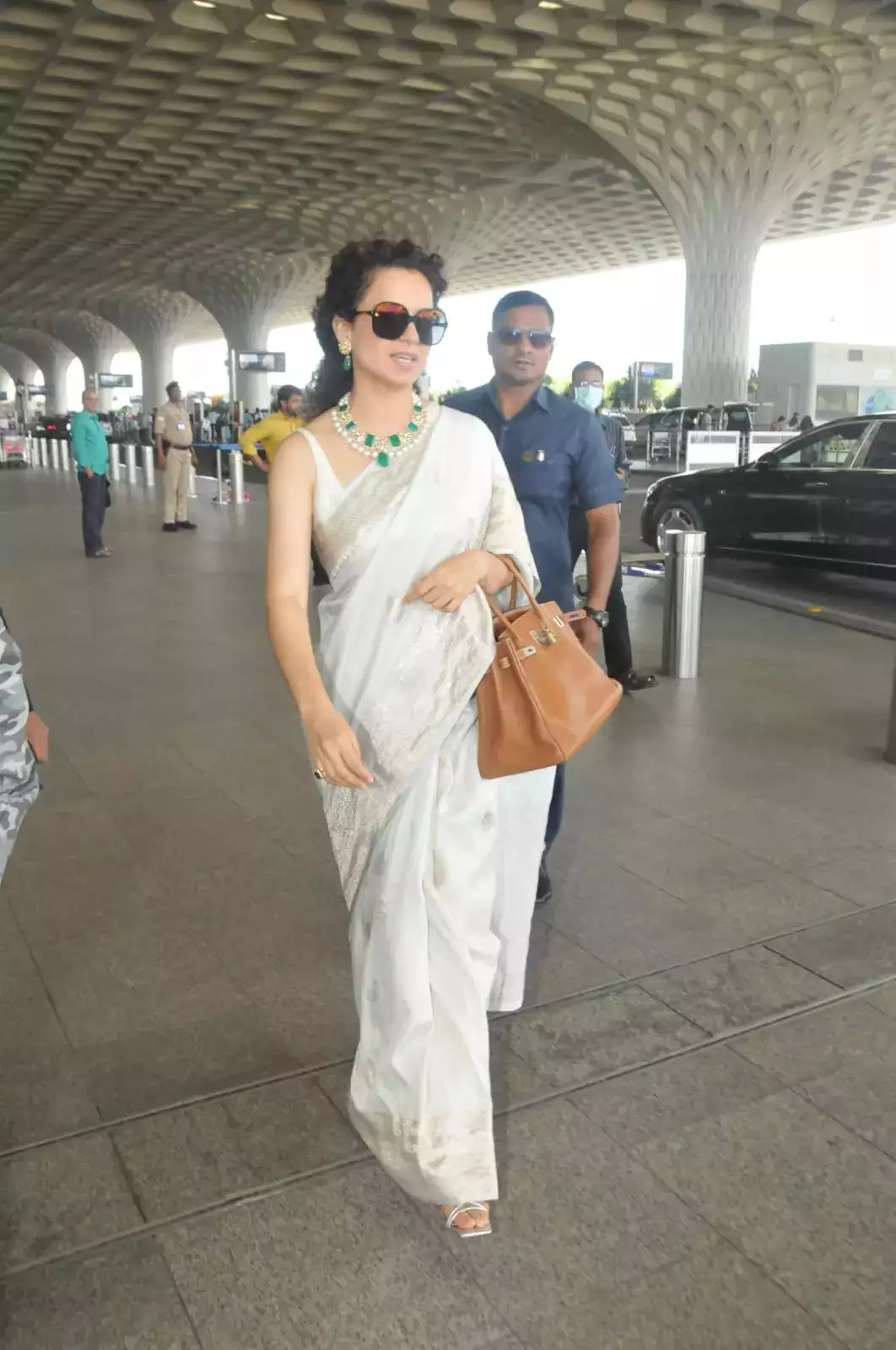 Kangana Ranaut in a white saree at the airport
