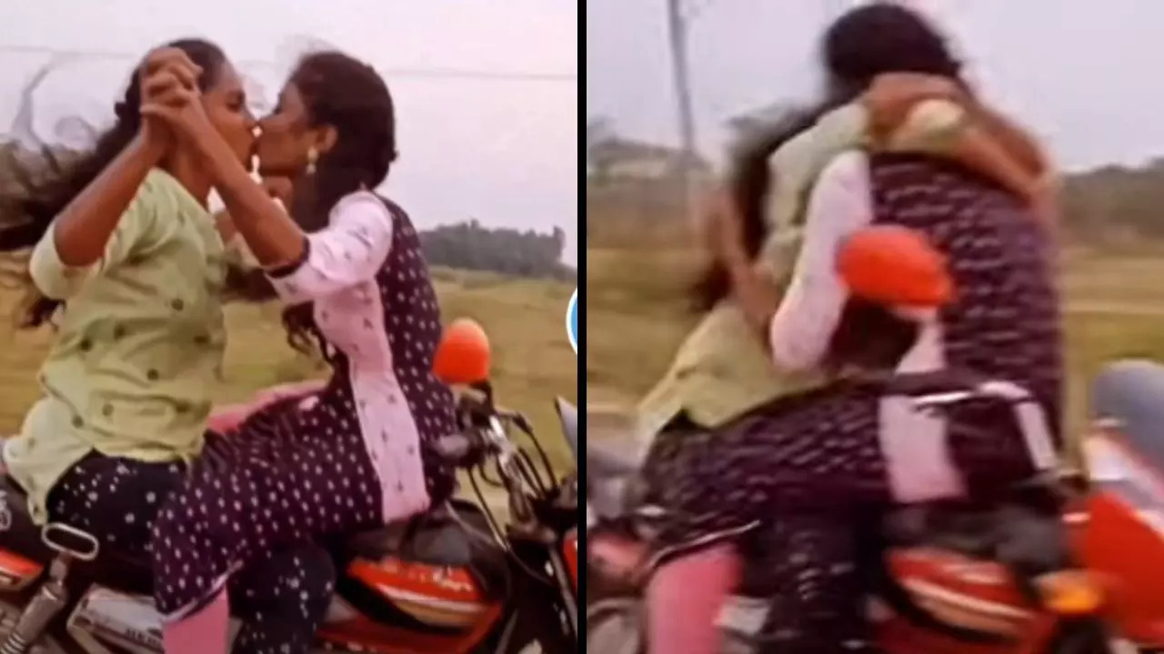 Two unidentified girls kiss and hug on a moving bike with a Tamil Nadu registration plate | Screenshot from @stars_of_jharkhand/Instagram