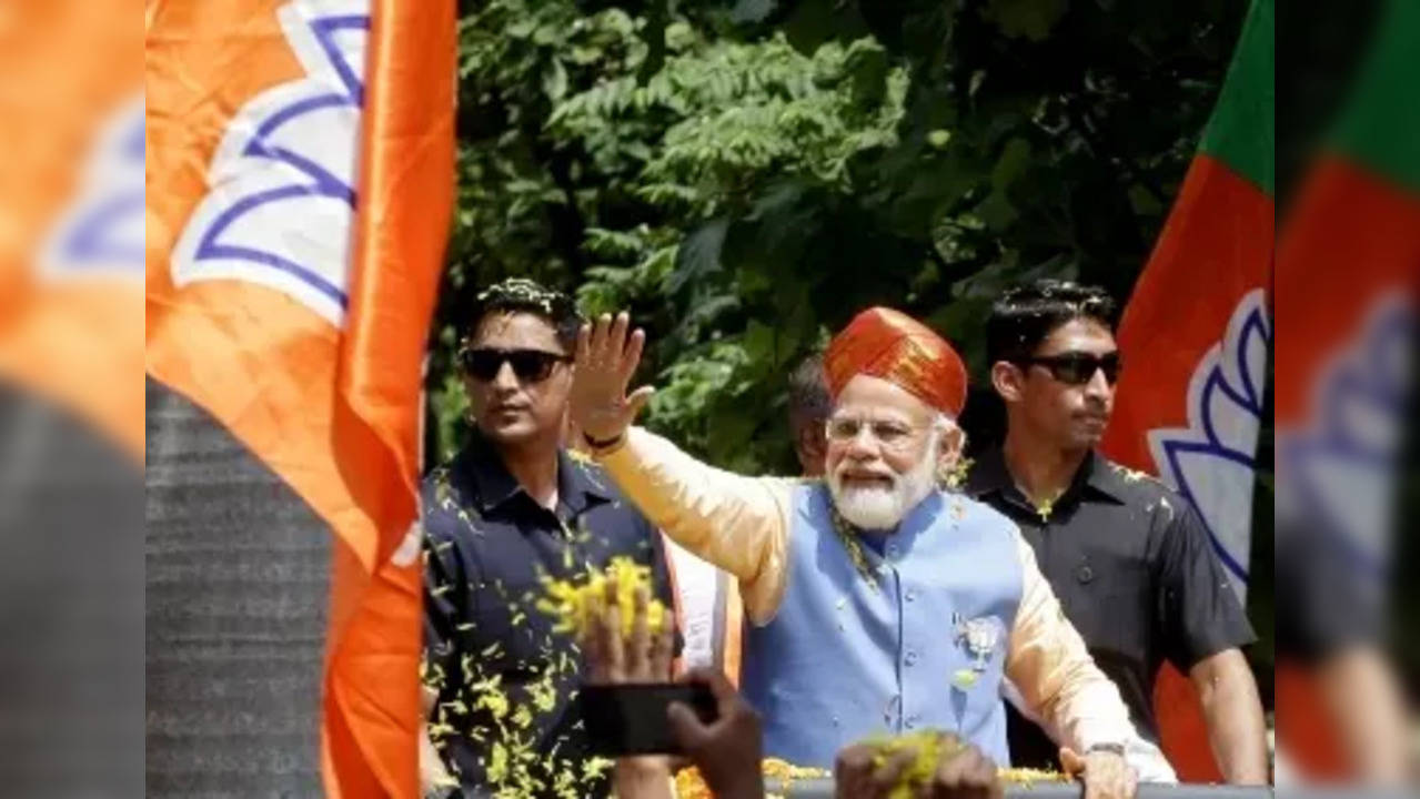 Bengaluru: Prime Minister Narendra Modi during a roadshow at Puttenahalli , BTM layout Assembly constituency ahead Karnataka Assembly polls ahead of Karnataka Assembly elections, in Bengaluru, Saturday, May 6, 2023. (Photo: Dhananjay Yadav/IANS)