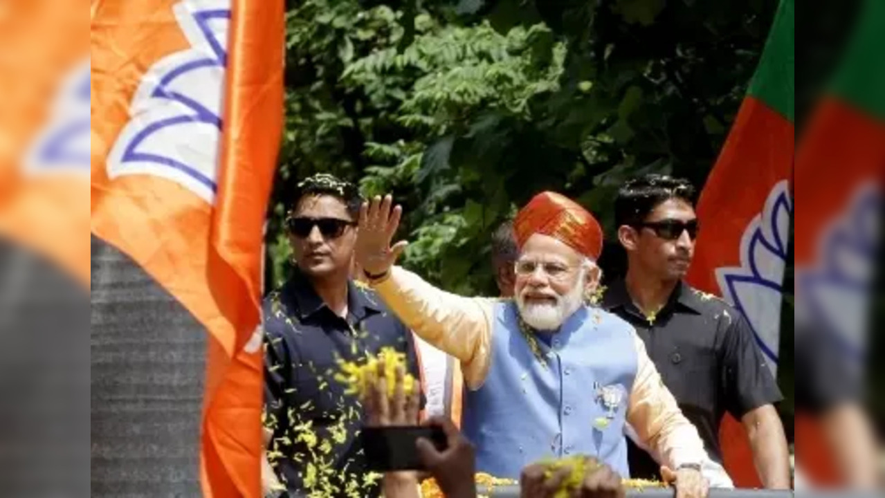 Bengaluru: Prime Minister Narendra Modi during a roadshow at Puttenahalli , BTM layout Assembly constituency ahead Karnataka Assembly polls ahead of Karnataka Assembly elections, in Bengaluru, Saturday, May 6, 2023. (Photo: Dhananjay Yadav/IANS)