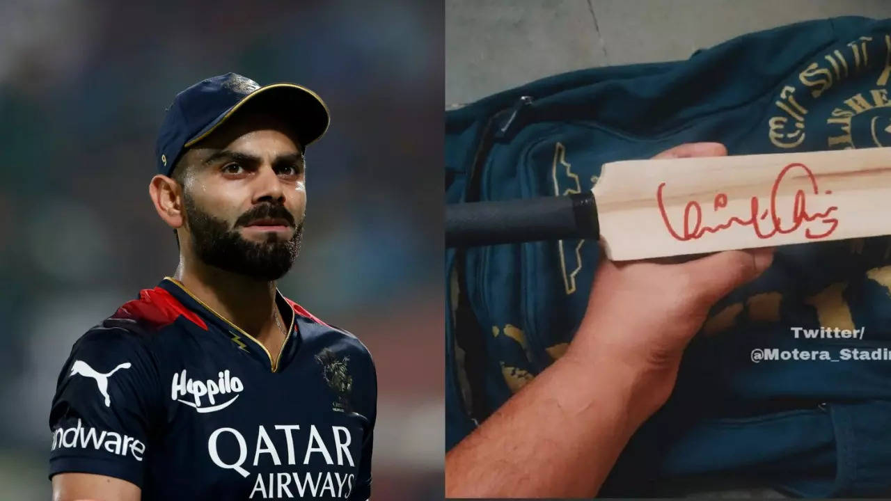 Virat Kohli Signs Autograph For Fan