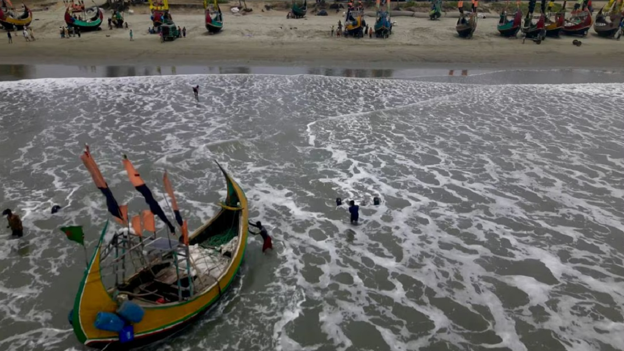 A drone view shows fishermen portaging their boats to safer ground due to Cyclone Mocha, in Teknaf Marine Drive, Cox's Bazar, Bangladesh May 12, 2023