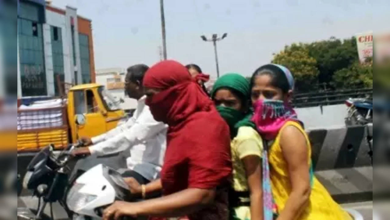 Hyderabad: People cover their face to protect themself from the heat wave in Hyderabad, on April 4, 2015. (Photo: IANS)