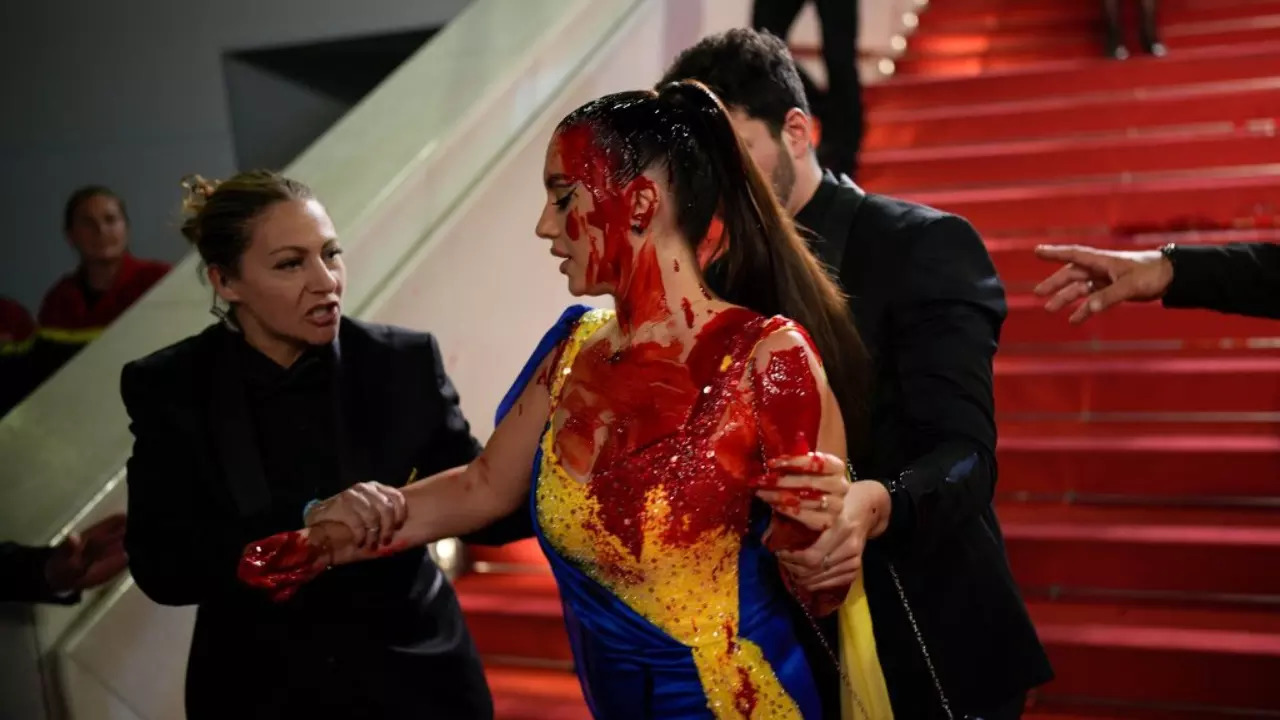 Cannes 2023: Woman Clad In Colours Of 'Ukrainian Flag', Splashes Fake Blood On Herself At Red Carpet