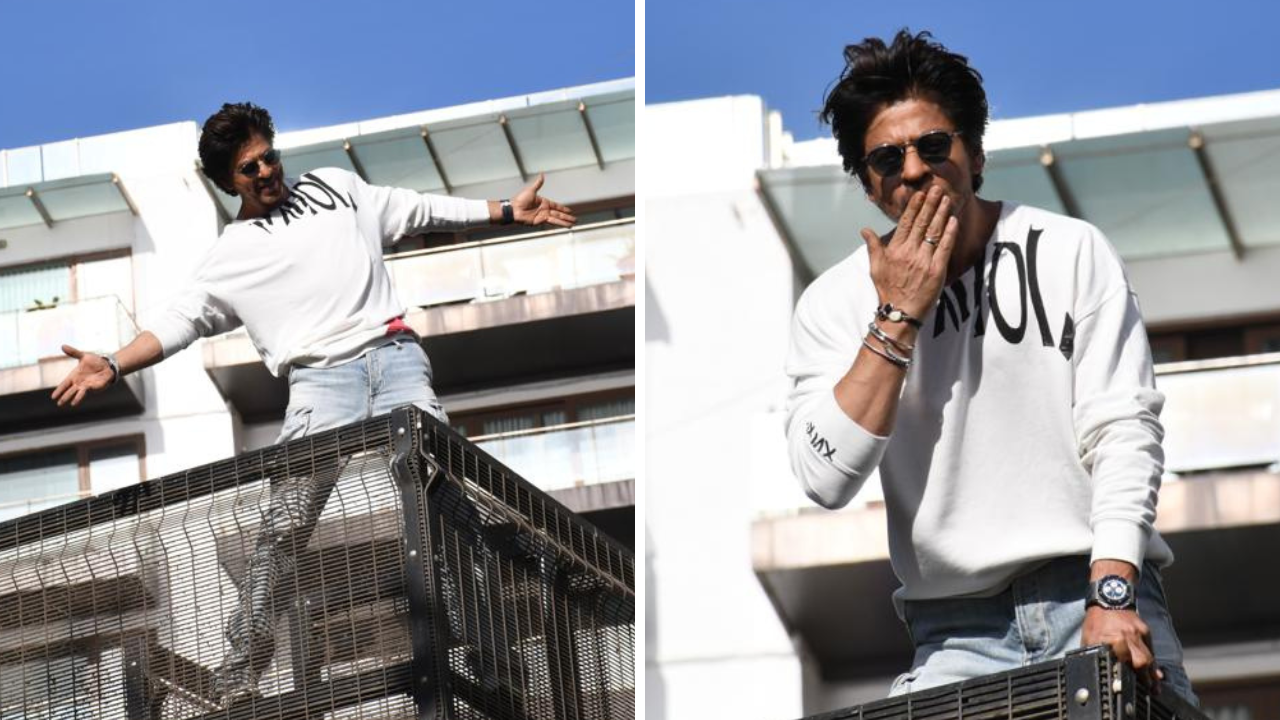 ​​​Shah Rukh Khan greets fans waiting outside Mannat