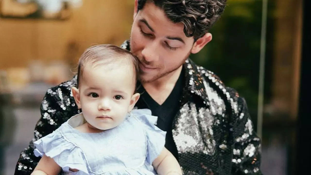 Nick Jonas with baby Malti