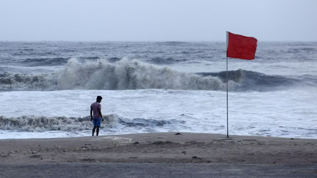 A lifeguard patrols Juhu beach, during a red flag alert due to rough seas caused by cyclone Biparjoy, in Mumbai, India, June 12, 2023.