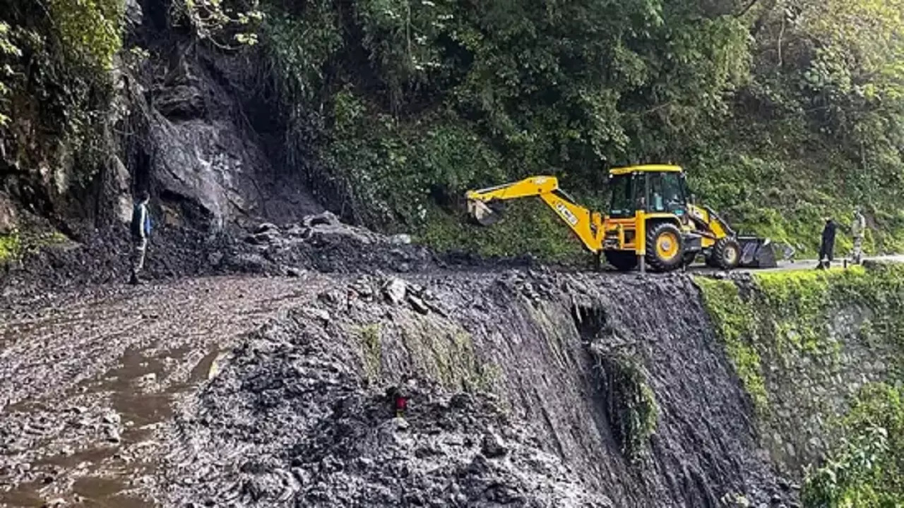 Gangtok: Army personnel clear a road that got blocked following a landslide, in Sikkim