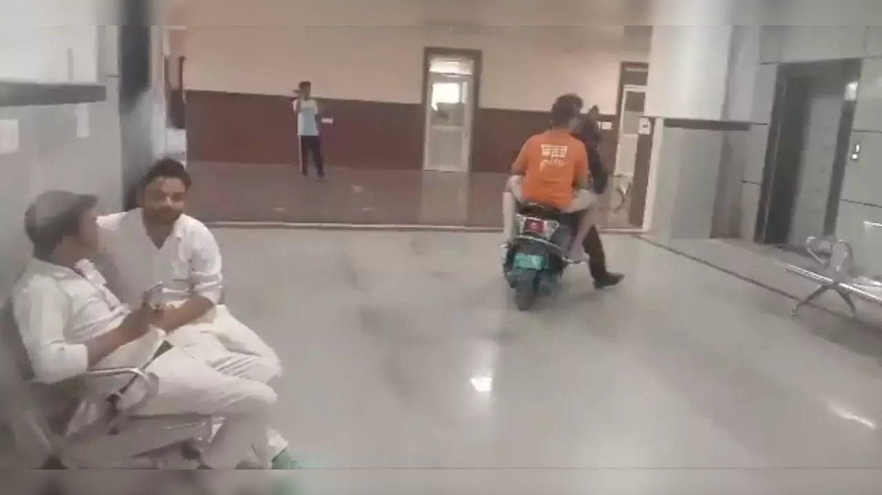 ​Man Rides Scooter Inside Kota Hospital With Injured Son​