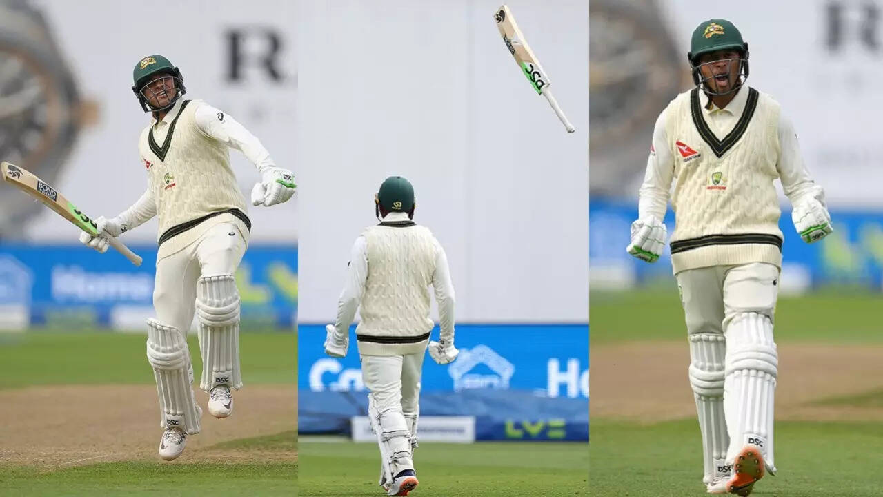 Usman Khawaja celebrates his 100.