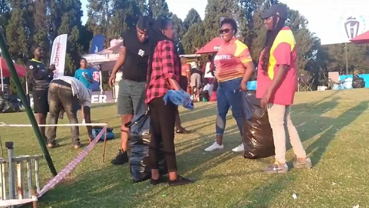 Zimbabwe fans clean stadium.