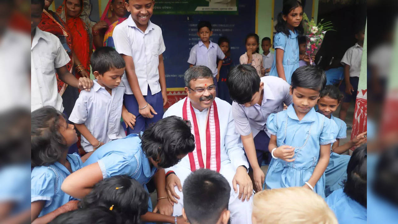 Union Education Minister Shri Dharmendra Pradhan in a candid moment with students of his primary school Handidhua Primary School in Talcher, Odisha