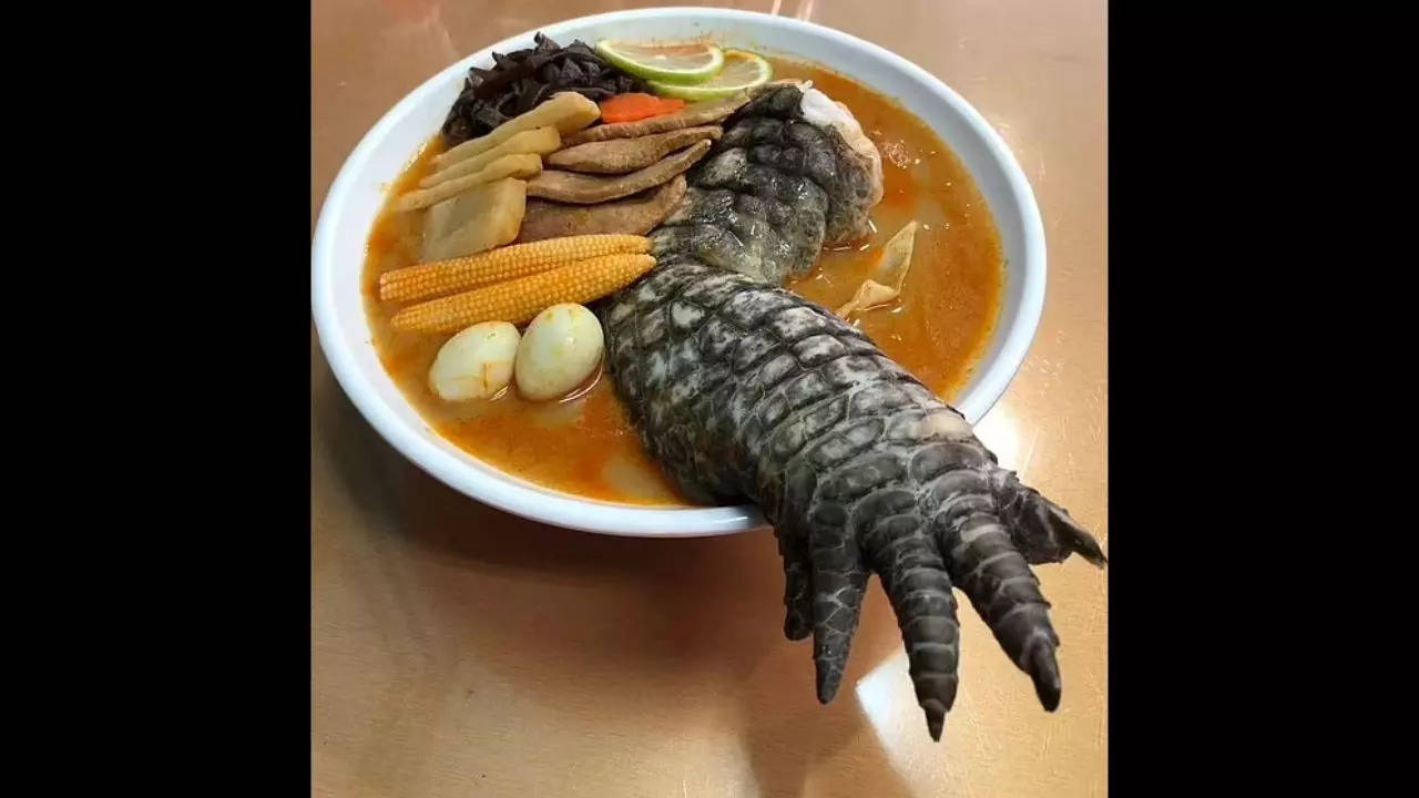 A crocodile leg emerges from the bowl of a dish dubbed 'Godzilla Ramen', which is a hit in Taiwan. | Courtesy: YoYarLay/Facebook