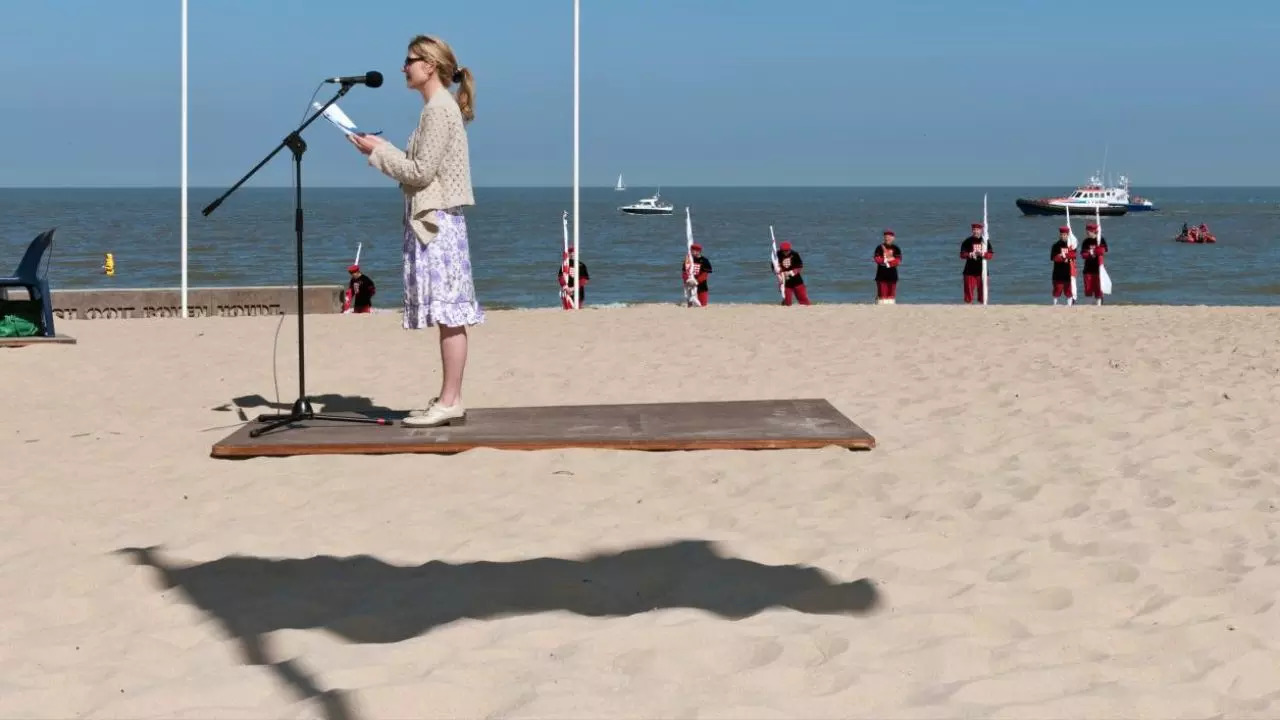 A shadow cast on a beach in Belgium creates the optical illusion that an EU speaker is levitating above the sand | Credit: The Sunday Times