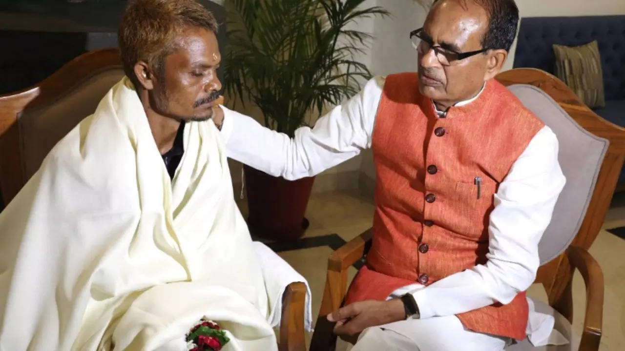 MP CM Shivraj Singh Chouhan with Sidhi urination incident victim