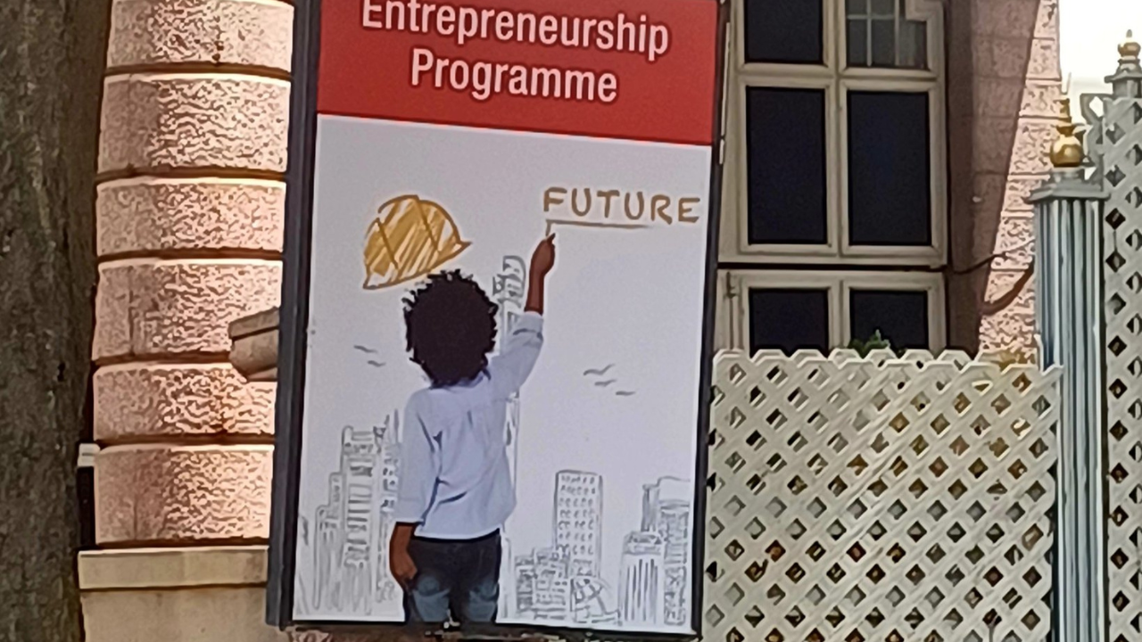 A signboard for a young entrepreneurship programme appears outside a Bengaluru school. | Image courtesy: @Bhavana_MA