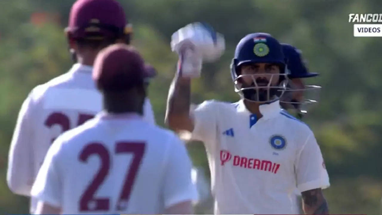 Virat Kohli celebrates after scoring his first boundary.