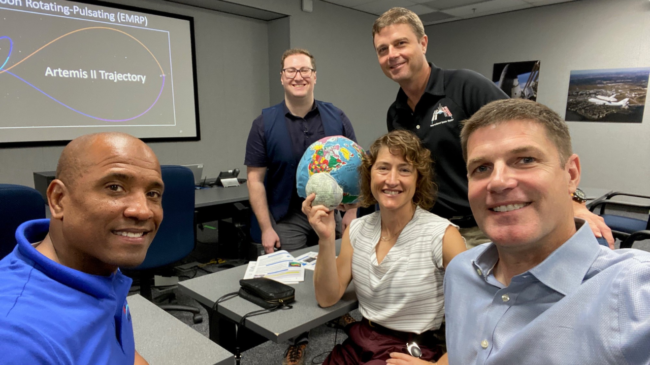 On the first day of Artemis II crew training, the astronauts Victor Glover, Christina Koch, Reid Wiseman, and Jeremy Hansen are joined by an instructor (background).