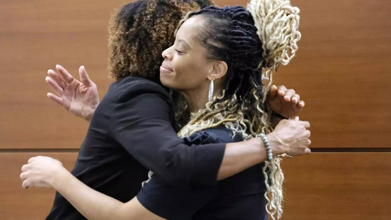 Philana Holmes hugs her lawyer after being awarded Rs 6.5 crore in damages by jury's verdict in the McDonald's hot chicken nugget lawsuit | South Florida Sun-Sentinel