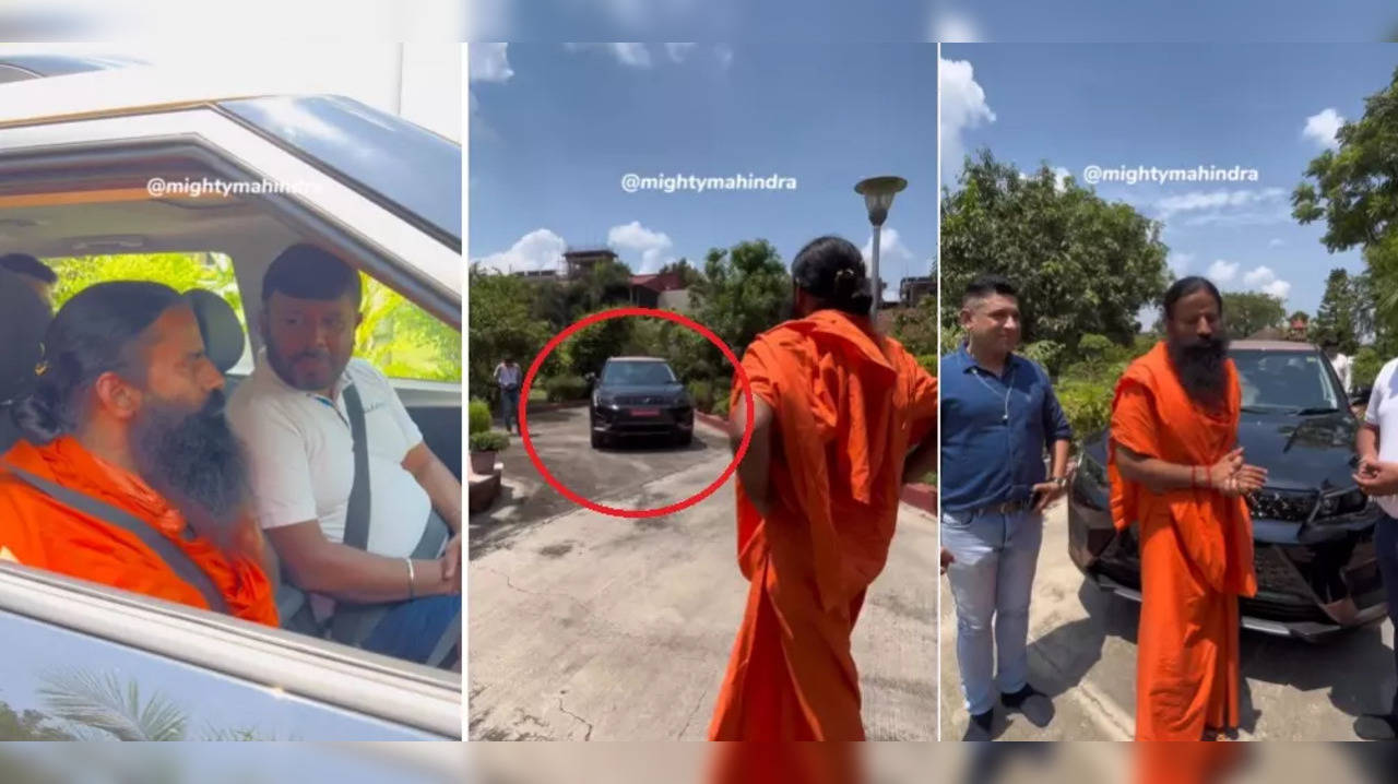 Baba Ramdev takes test drive of Mahindra XUV400