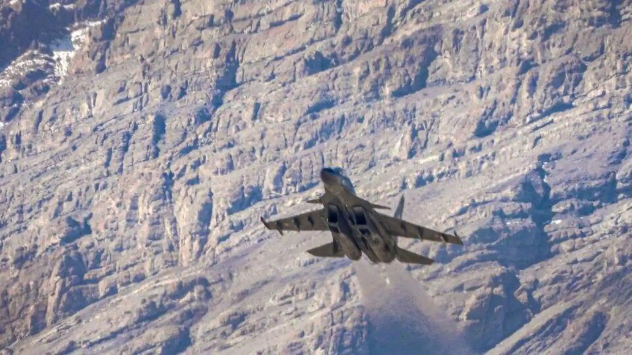 An Indian Air Force fighter jet flies in the backdrop of Himalayan mountain ranges, amid de-escalation efforts by India and China in eastern Ladakh, in Leh. (PTI)