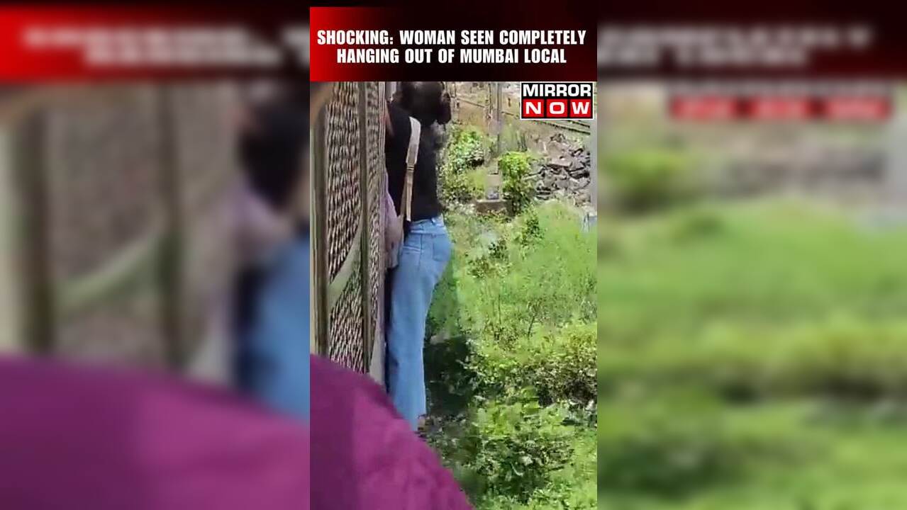 Shocking Woman Seen Completely Hanging Out Of Mumbai Local
