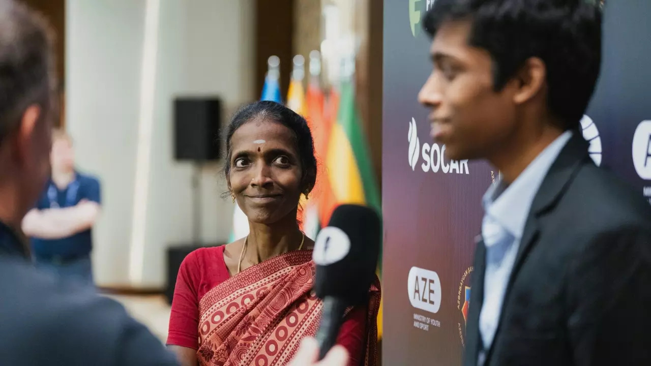 Rameshbabu Praggnanandhaa's mother R Nagalakshmi gazes at him with pride during a post-match interview after the FIDE Chess World Cup 2023 Quarter Final. | Image courest: Photo Chess