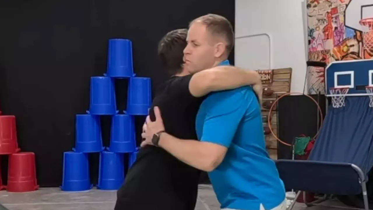 David Rush and Josh Horton attempt the Guinness World Record for most hugs in one minute. | Image credit: Screenshot via Record Breaker Rush