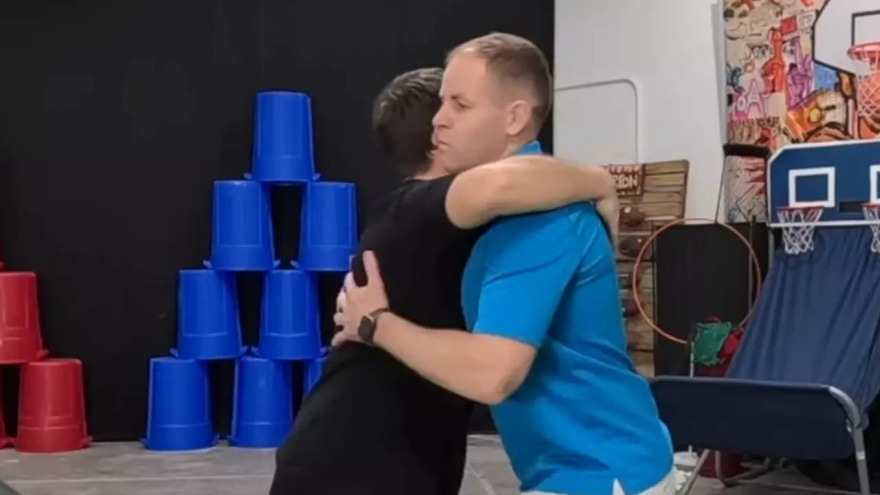 David Rush and Josh Horton attempt the Guinness World Record for most hugs in one minute. | Image credit: Screenshot via Record Breaker Rush