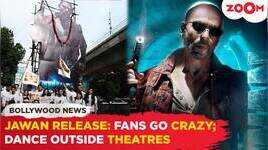 Jawan release Fans go crazy  SRK fans dance outside theatres  pours milk on his poster