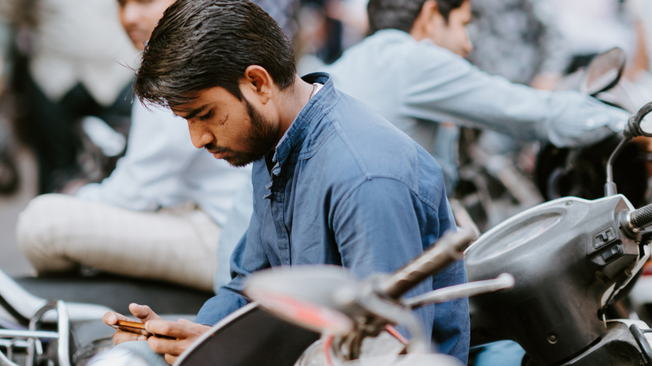 Indian man using smartphone