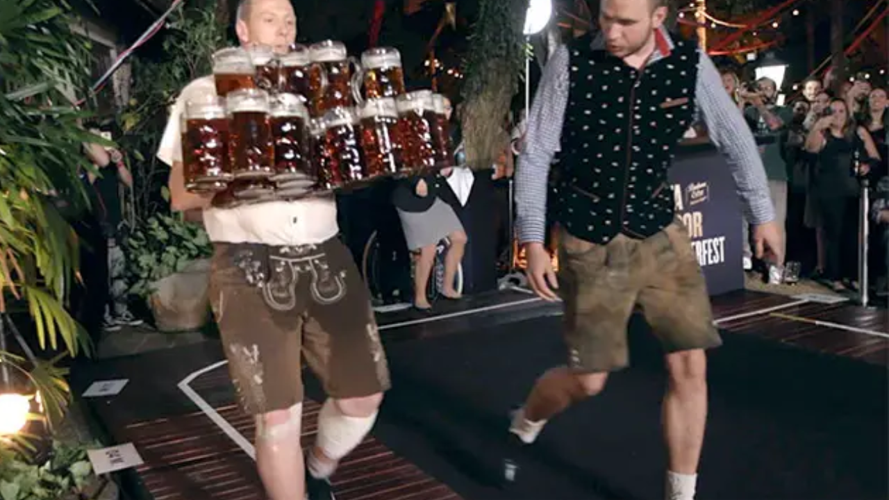 Man Breaks World Record By Carrying 26 Full Beer Mugs.