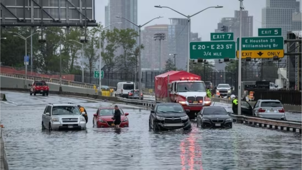 Cars in floodwater on the FDR highway in Manhattan, New York on September 29, 2023. (Photo by Ed JONES / AFP)(AFP)