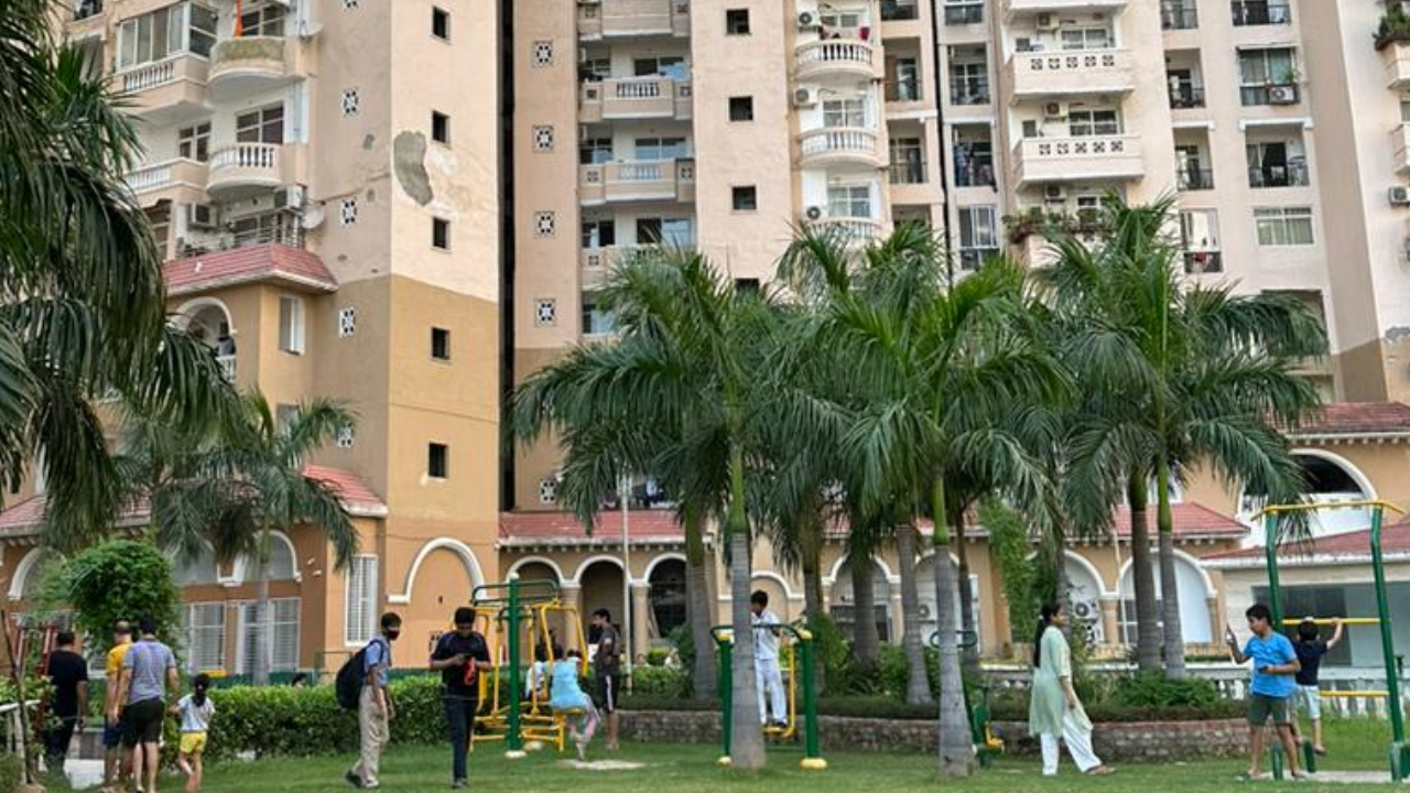 Residents gathered outside buildings in Noida society