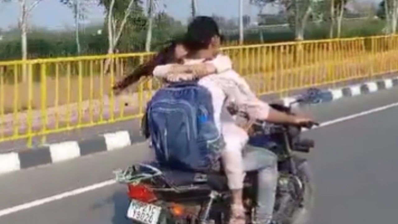 UP Couple Hug While Riding Bike.