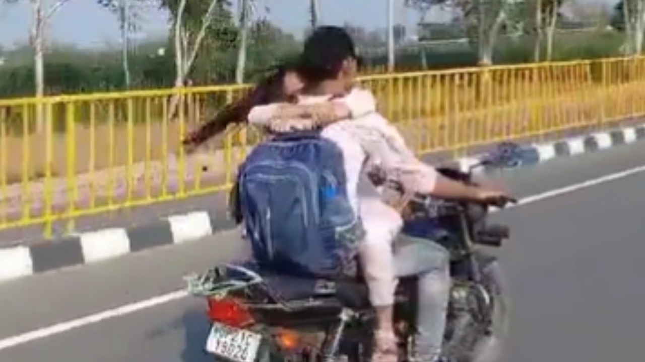 UP Couple Romance On Moving Bike In Viral Video, Fined ₹ 8,000 | Watch ...