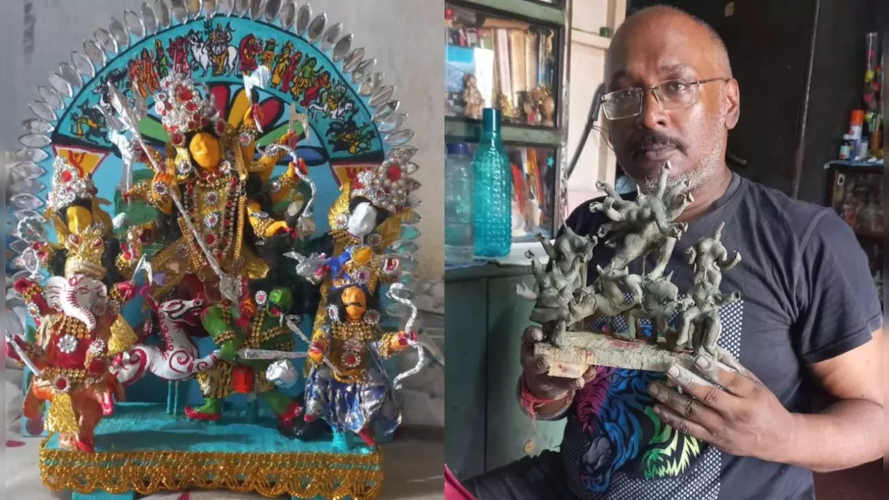 Sumit holding his miniature Durga idol