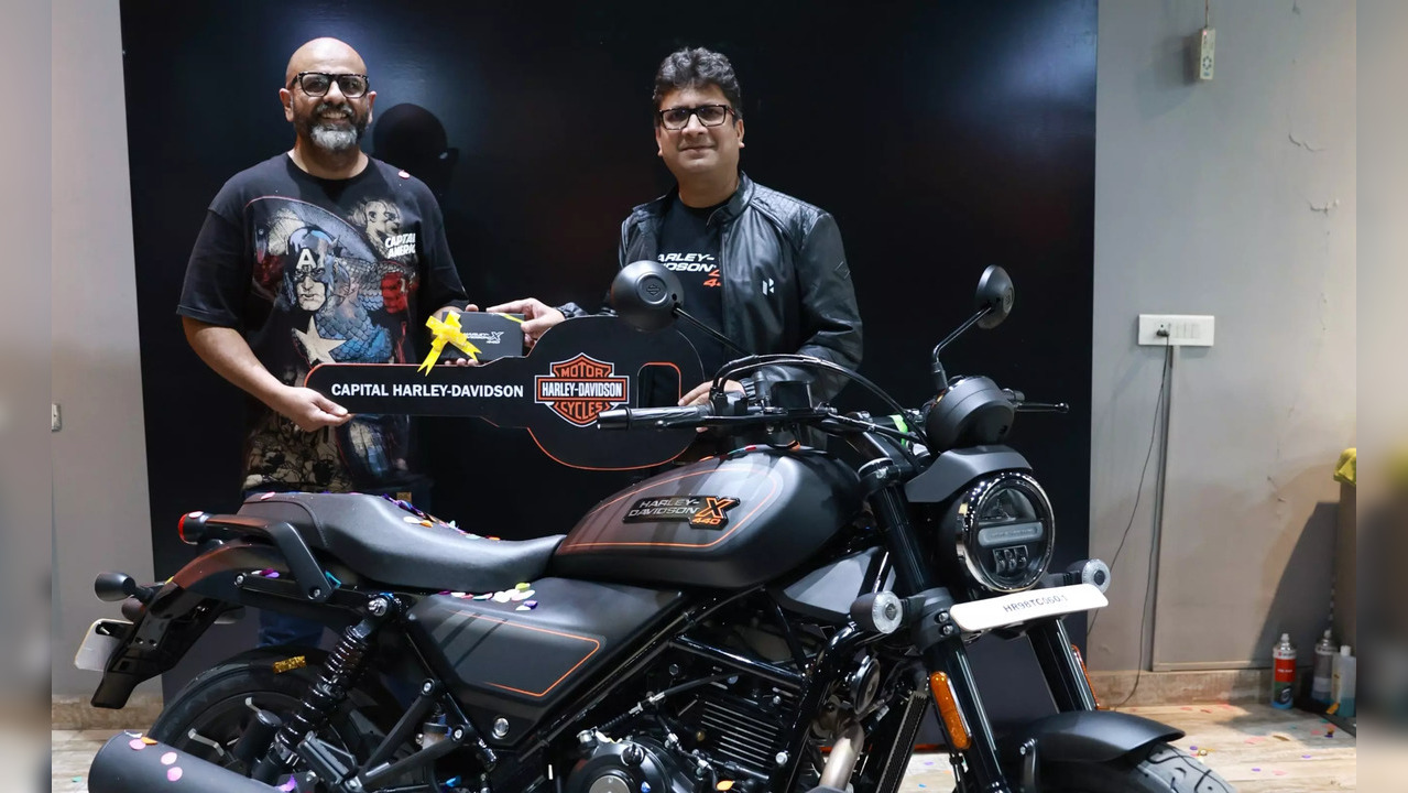 Niranjan Gupta, CEO, Hero MotoCorp, delivers the Harley-Davidson X440 to a customer in Gurugram