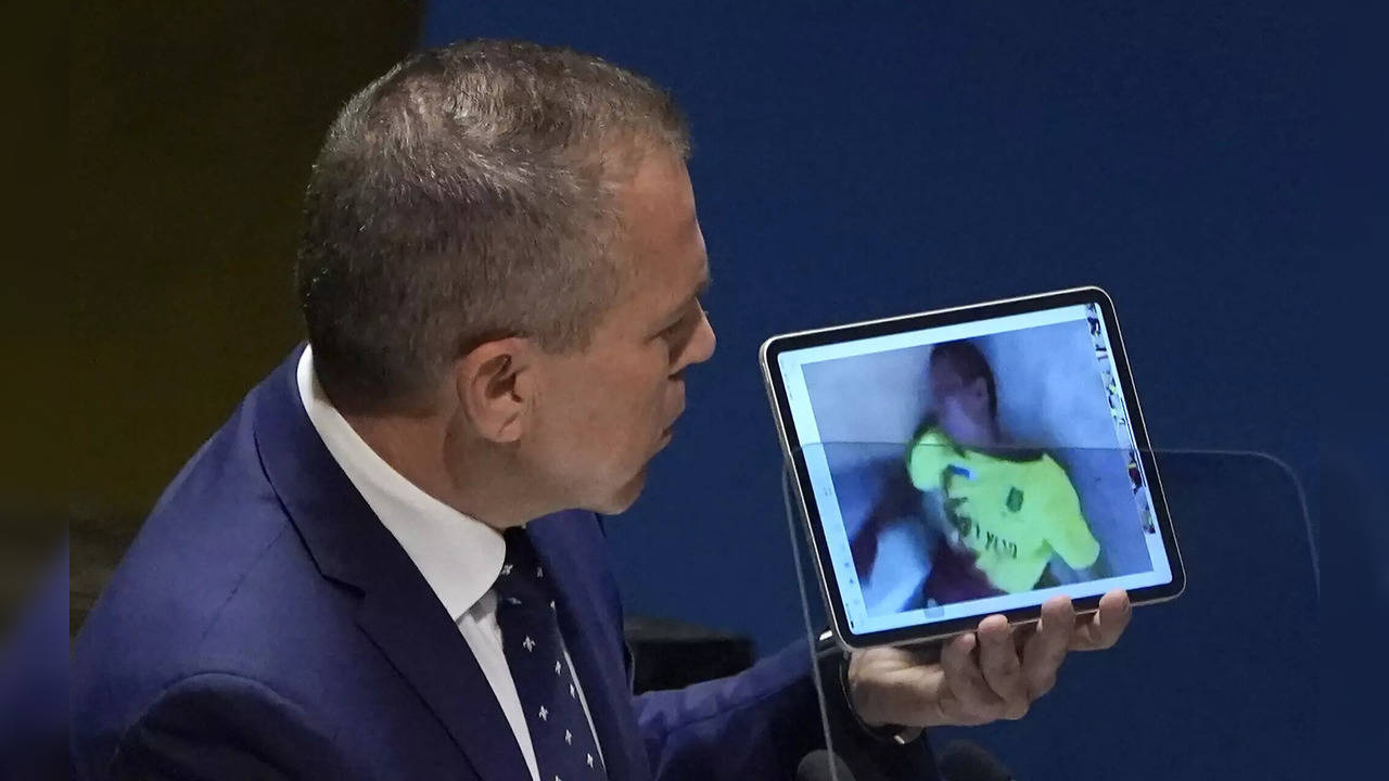 Israel's Ambassador to the UN Gilad Erdan holds footage from Hamas's October 7 massacre