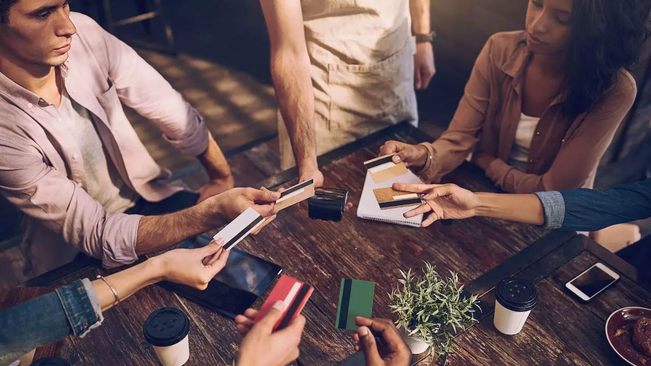 A group of friends splitting the restaurant bill