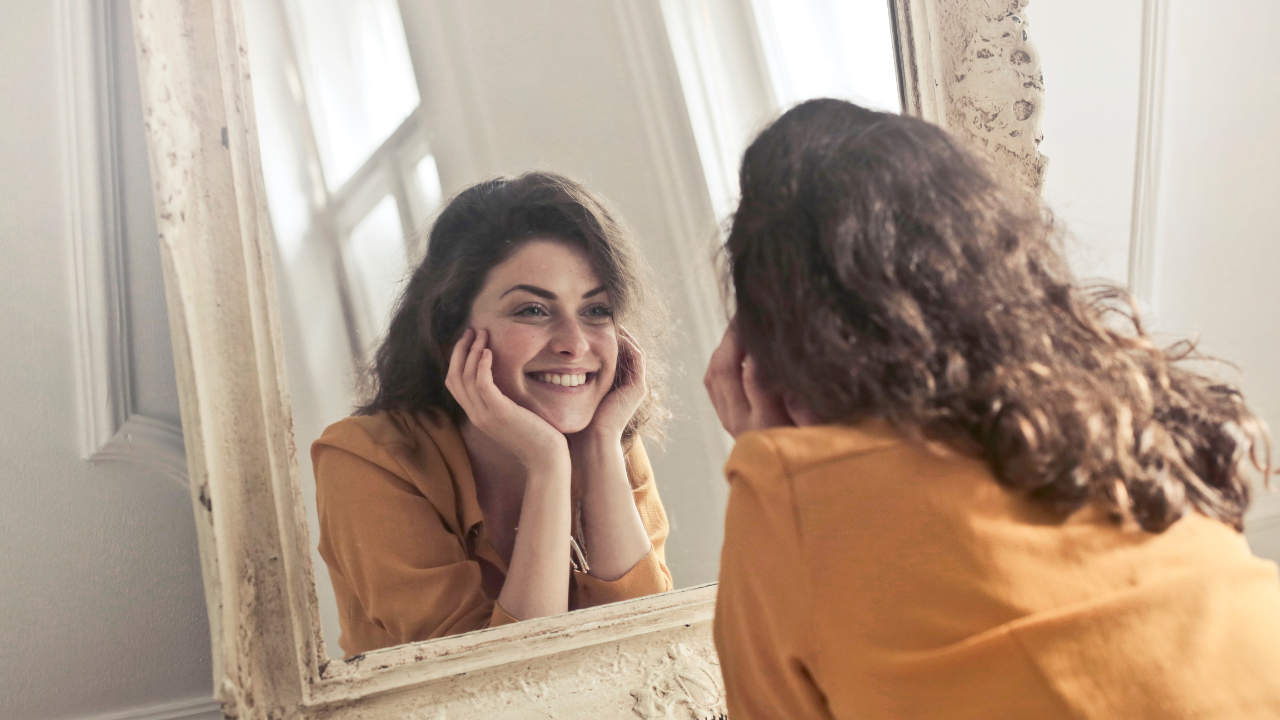 People find themselves more attractive while looking into a mirror than they really are, reveals a study. Pic Credit: Canva