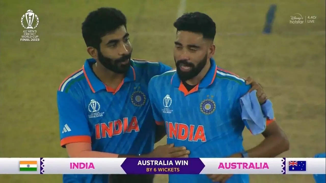 Jasprit Bumrah consoles Mohammed Siraj.