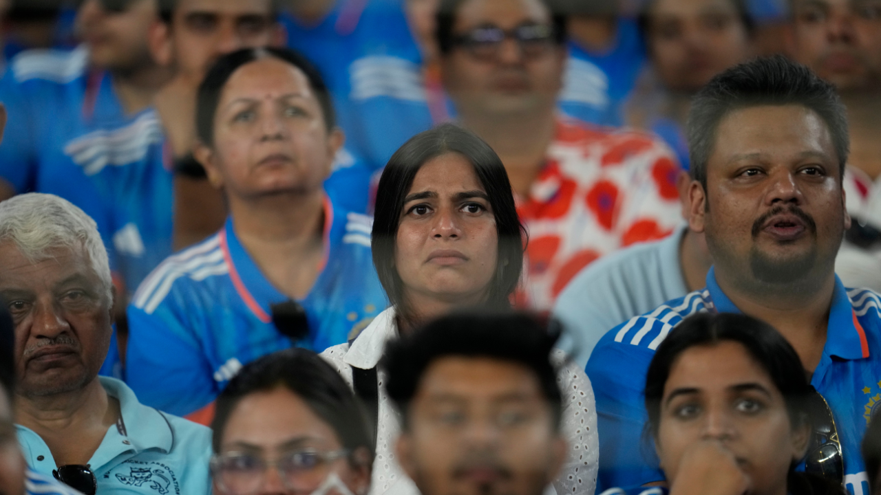 Spectators watch on in despair as Australia beat India to win their sixth World Cup title at Narendra Modi Stadium, Ahmedabad. | Image courtesy: Associated Press