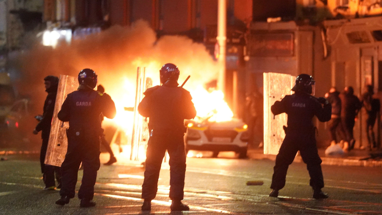 Five injured, including three children, in stabbing near school in Dublin; During the violent protest, people set fire