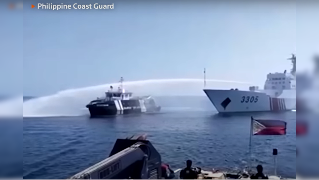 Chinese ship spraying water canon jets on Philipino vessel