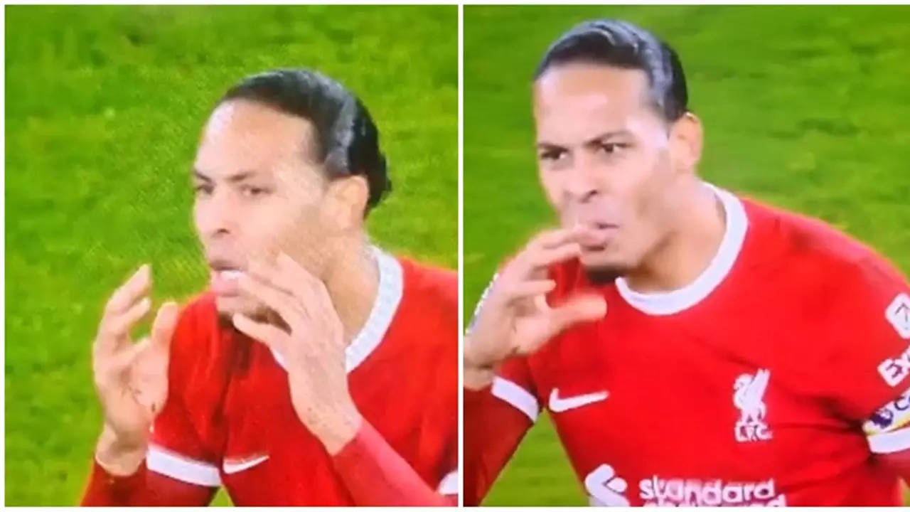 ​Virgil Van Dijk​ talks to the referee