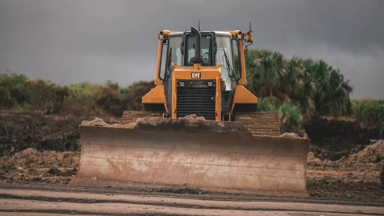 ​A representative picture of a bulldozer (Unsplash)