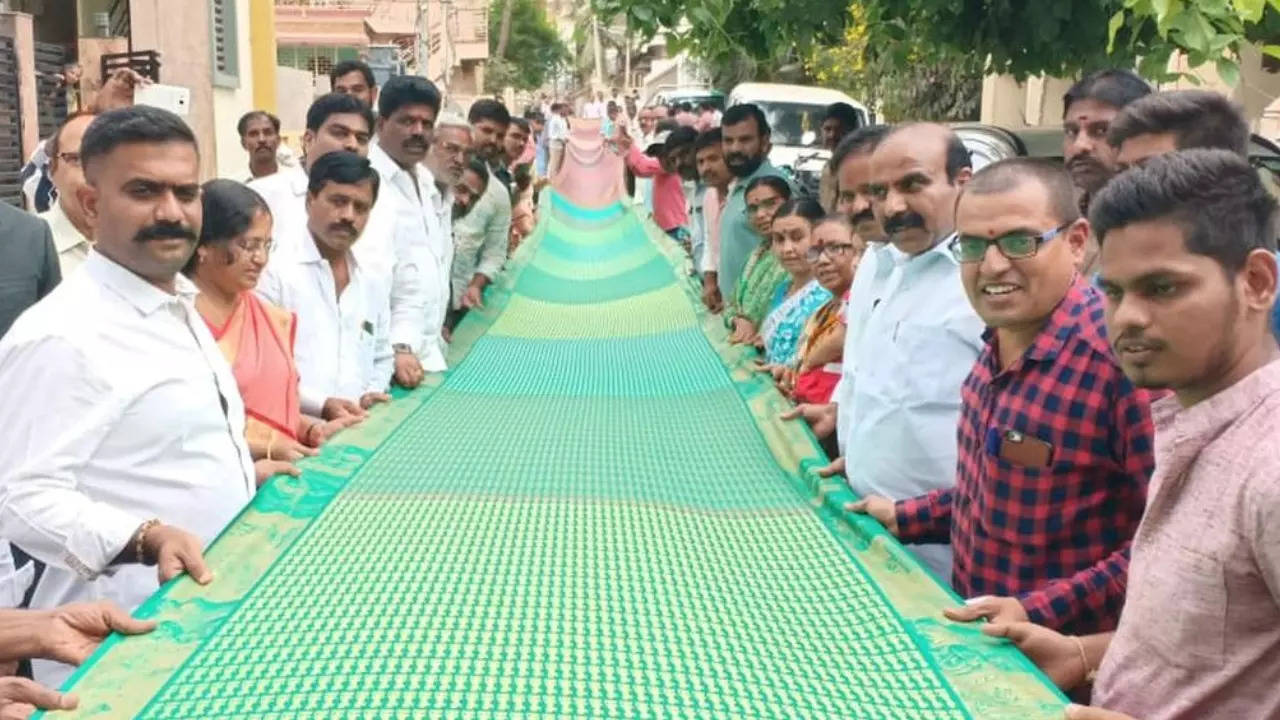 Dharmavaram locals pose with the saree to be gifted to the Ram Temple in Ayodhya.