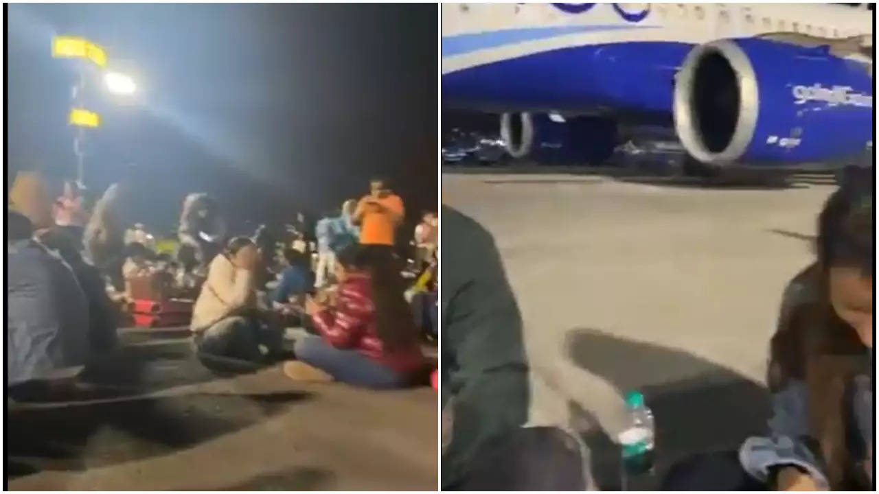 IndiGo passengers eating on tarmac.