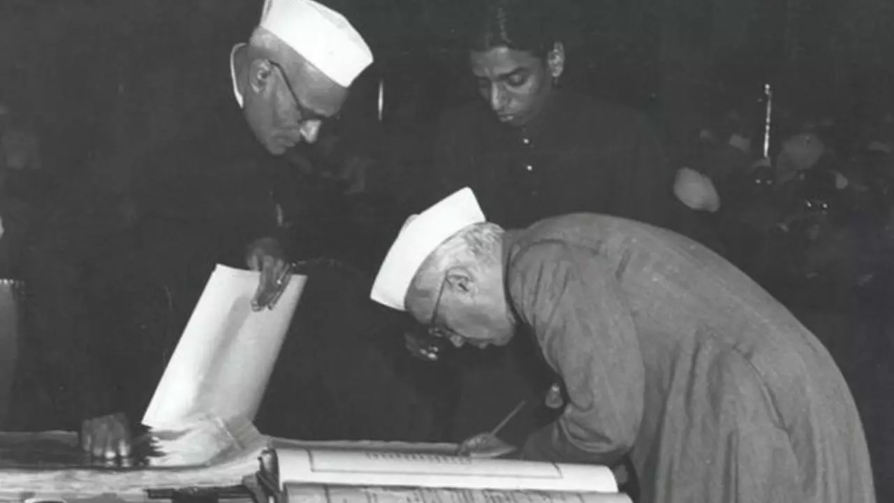 Jawaharlal Nehru, India's first Prime Minister, signs the Indian Constitution in 1950